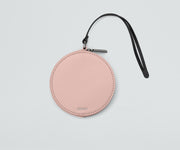 Front view of the Circle Zip Pouch with the leather strap