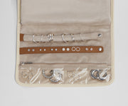 Close up view of the compartments and two padded holders for earrings and rings