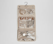 Unfolded Hanging Jewelry Oragnizer packed with jewelry and shown with the hook for easy hanging
