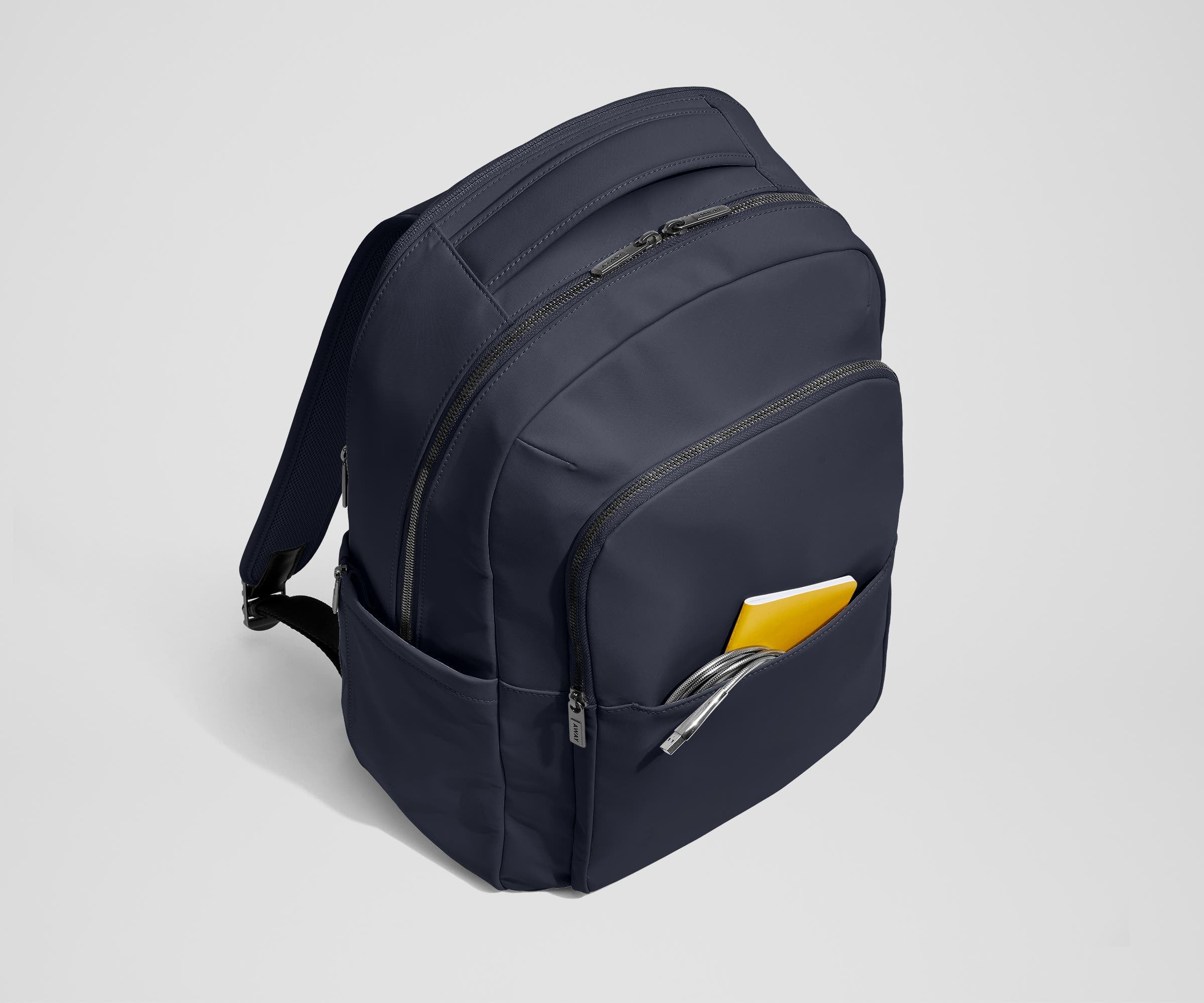 Front slip pocket with small notebook and charging cord