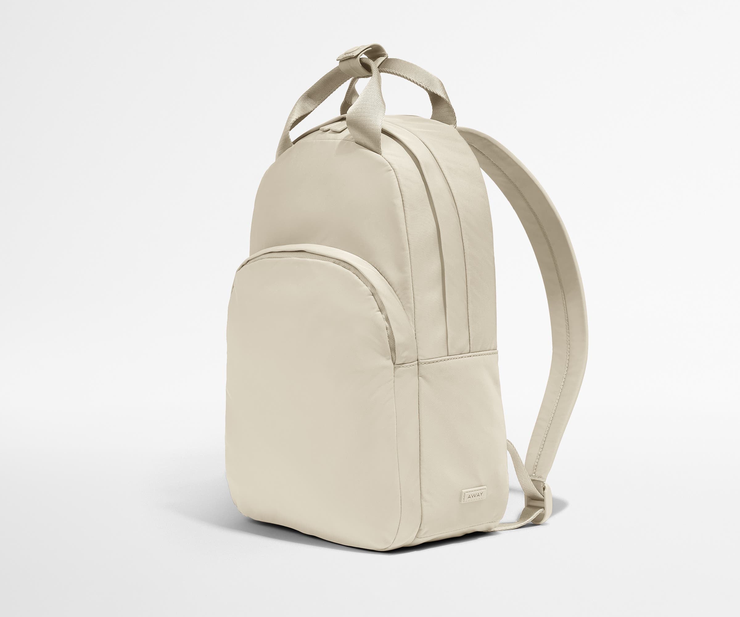 Video of a person packing the Featherlight Backpack with daily essentials