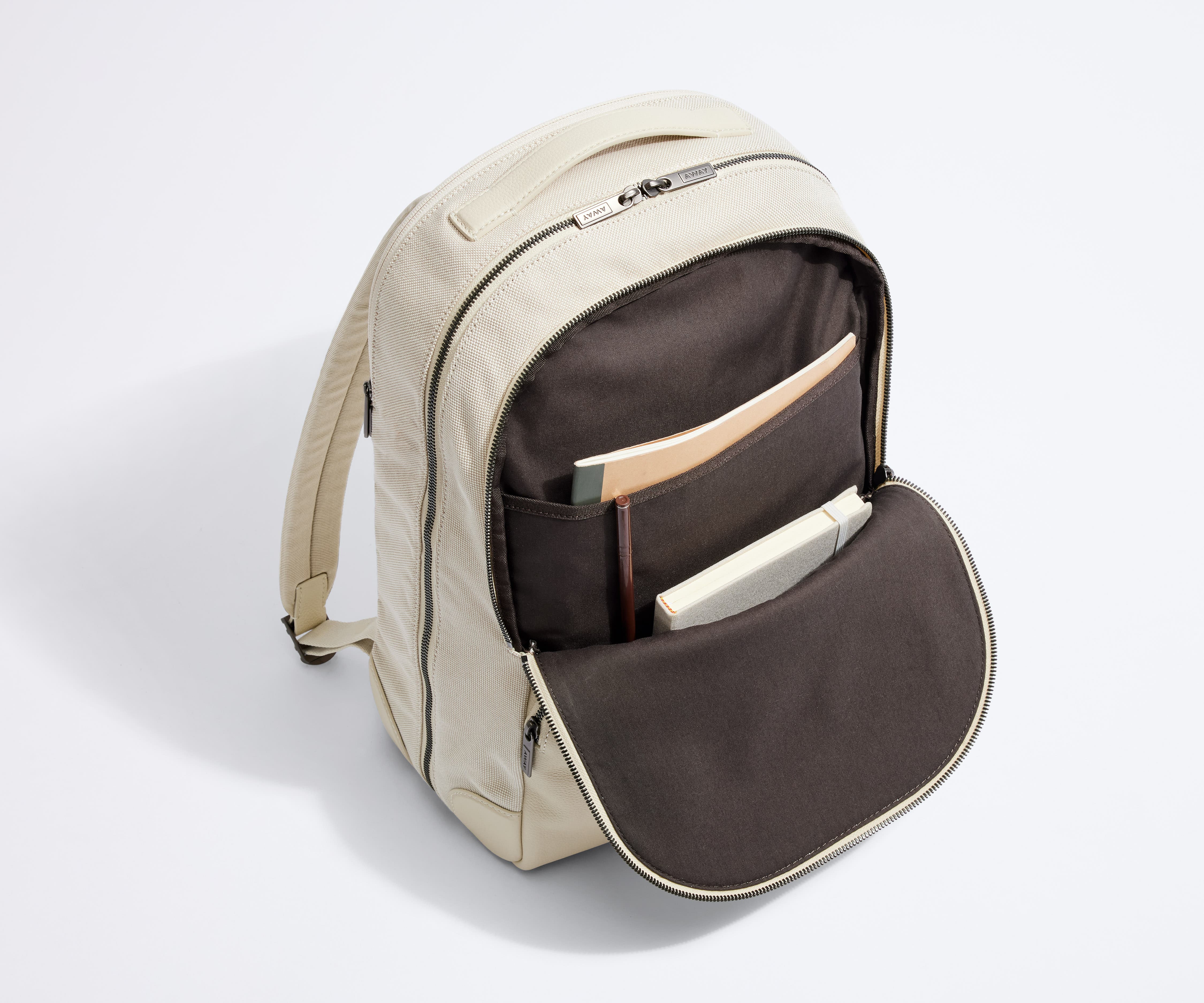 Front pocket packed with multiple notebooks