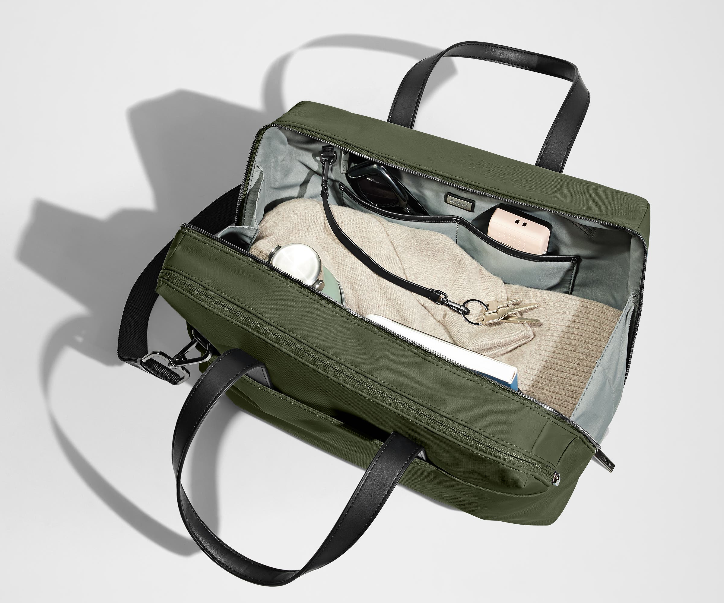 A pair of keys attached to the key leash in the main compartment