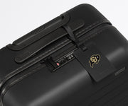 University of Colorado ® Collegiate Luggage Tag on a matching Collegiate Bigger Carry-On suitcase