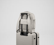 Double Diaper Backpack on top of an Away suitcase by the trolley sleeve