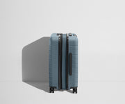 Side product view of The Carry-On Flex suitcase in Coast Blue shown fully expanded