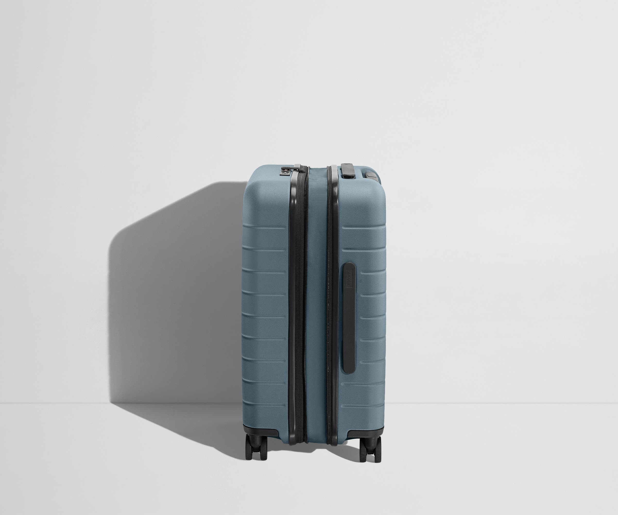 Side product view of The Carry-On Flex suitcase in Coast Blue shown fully expanded