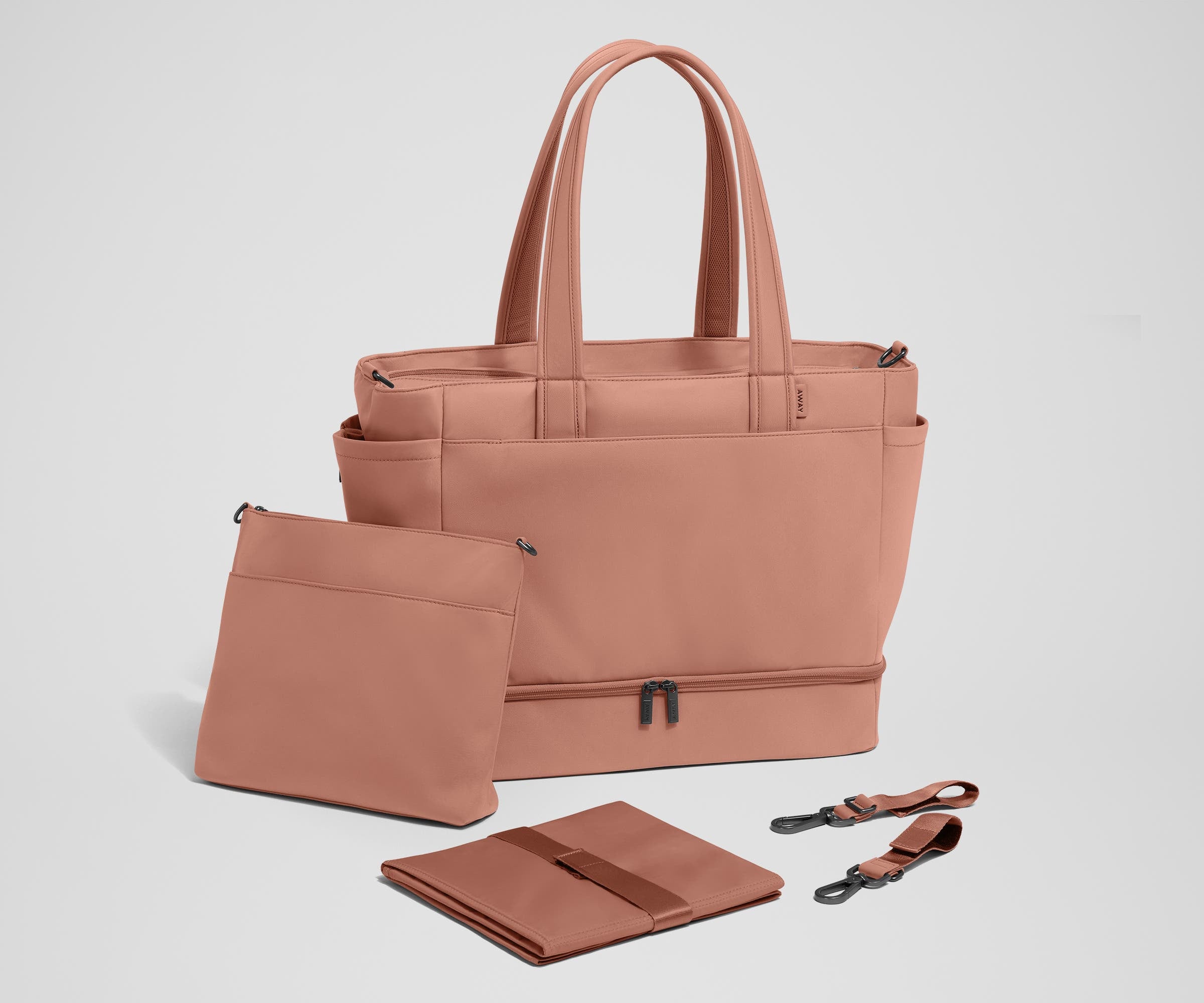 Tote with the included stroller clips, carry-all pouch, and changing pad