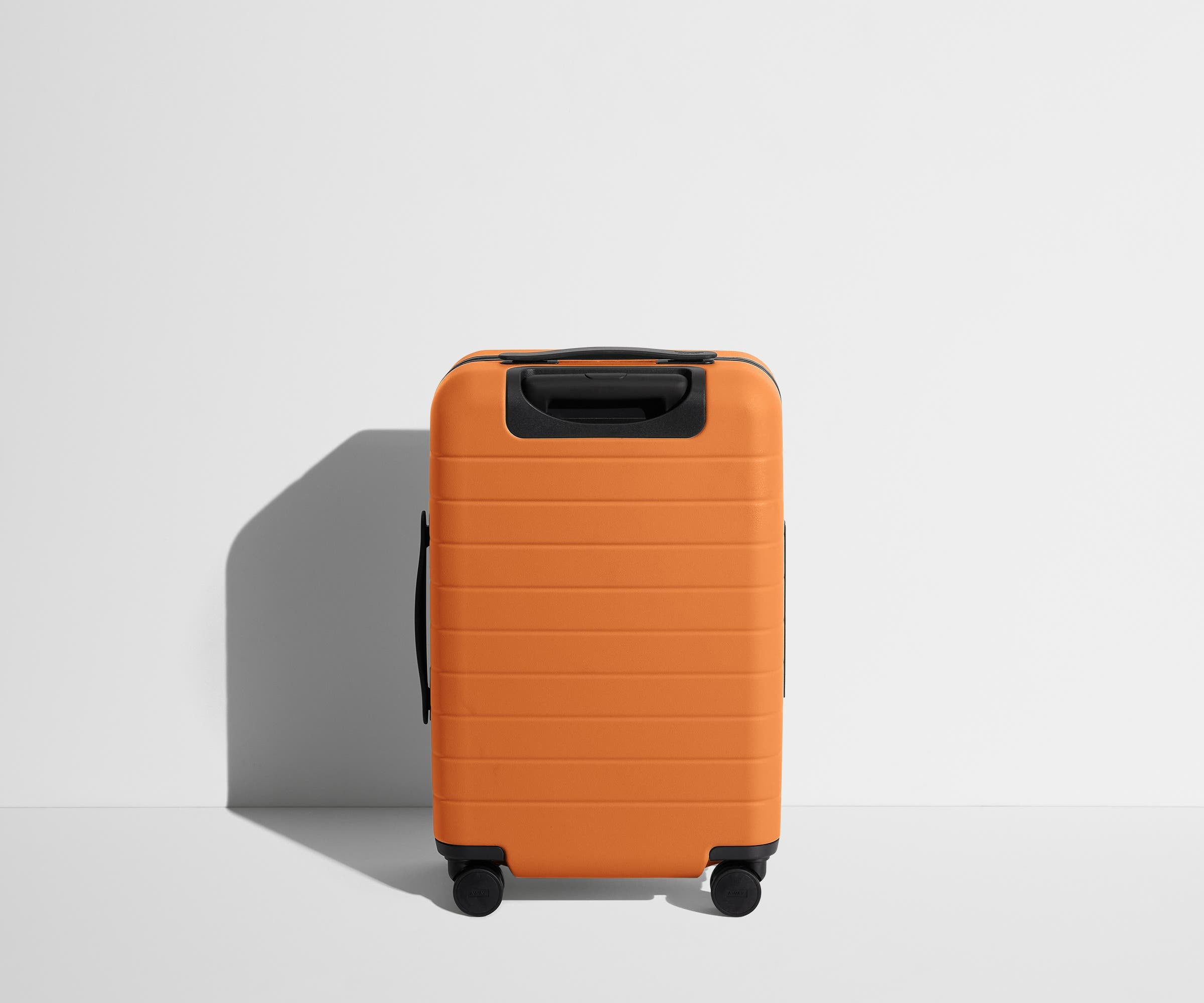 Back product view of The Carry-On suitcase in Sorbet Orange