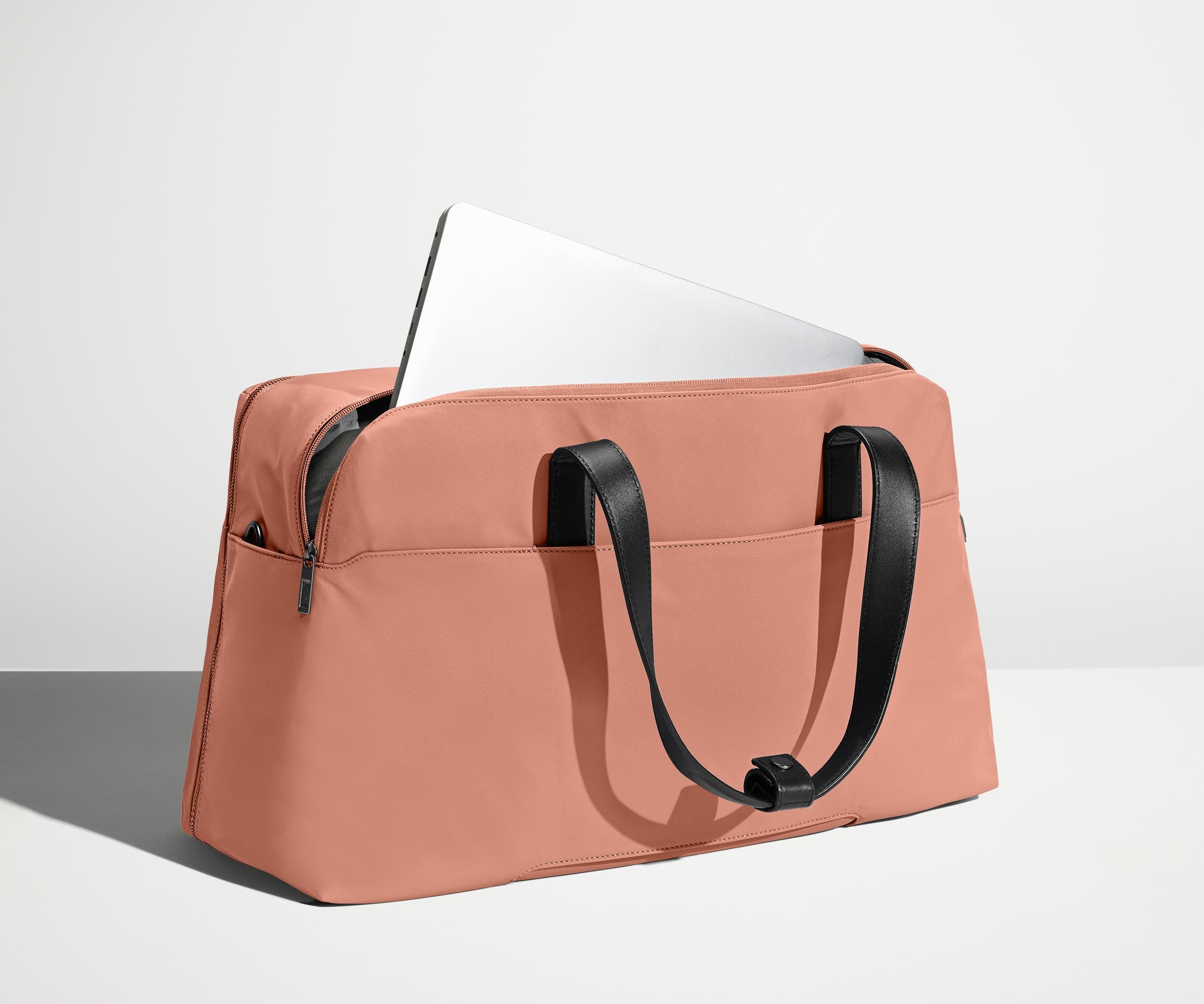 Open, unpacked Weekender Bag showing the mesh compartments and pockets