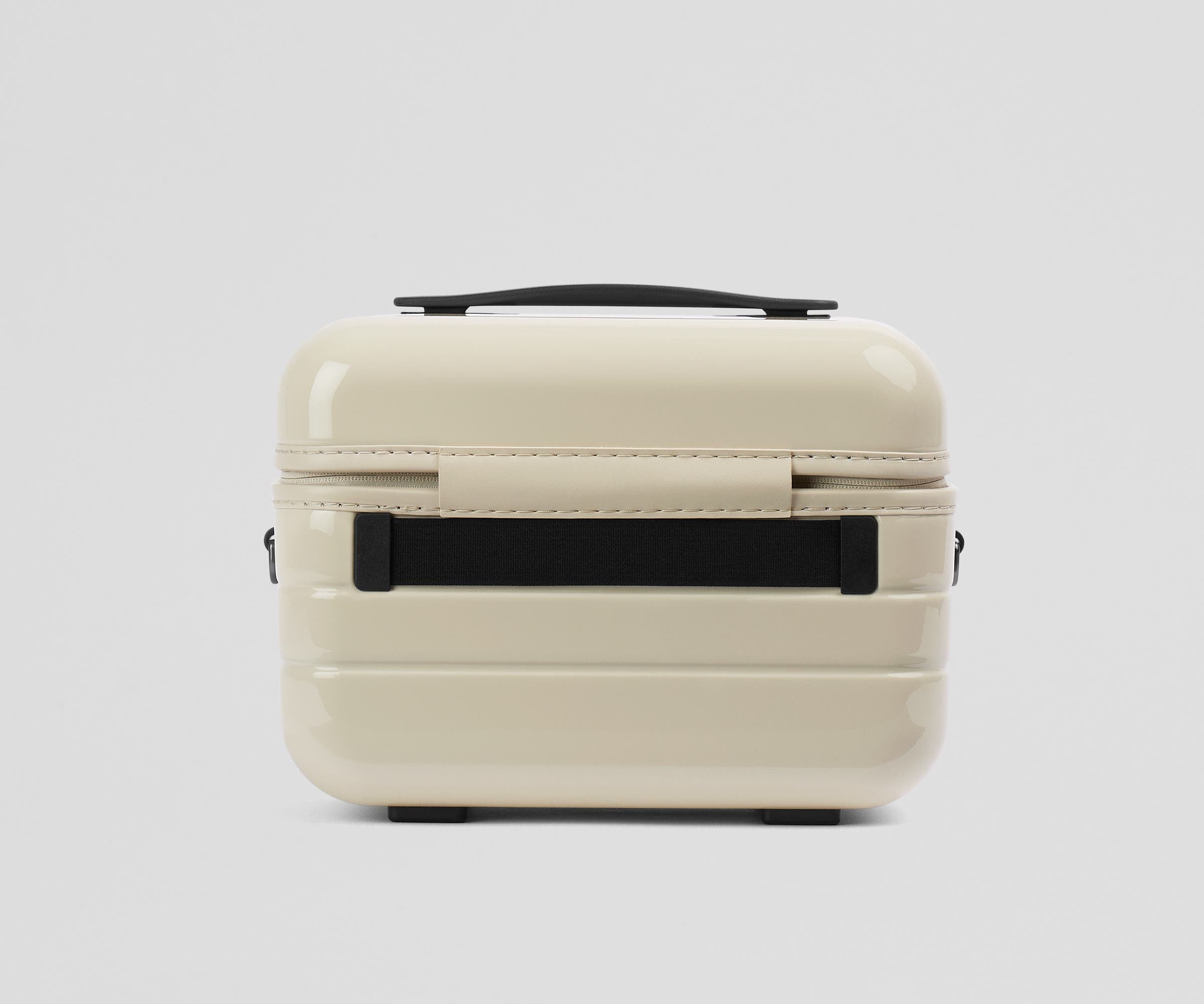 Elastic trolley strap on the back of the Train Case