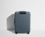 Back product view of The Medium suitcase in Coast Blue