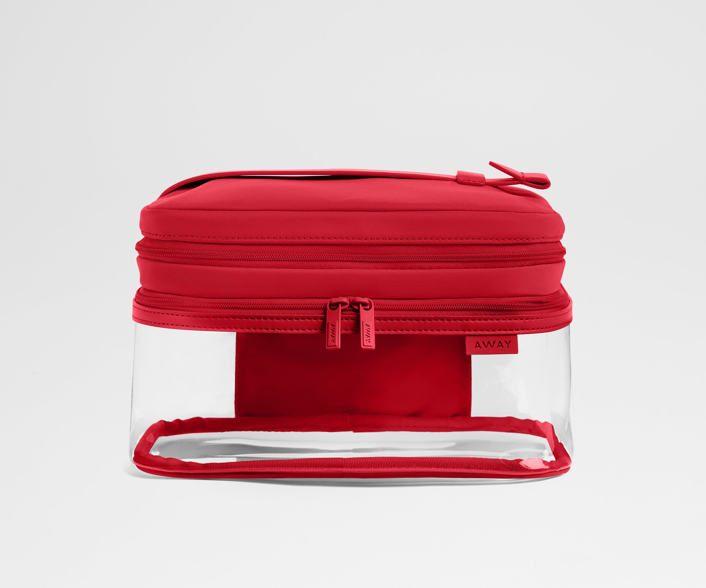 clear travel makeup bag madewell Away Clear Cosmetic Case in Cherry Red