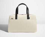 Front view of The Overnight Bag with leather straps up