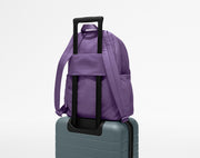 Large Featherlight Backpack on top of an Away suitcase
