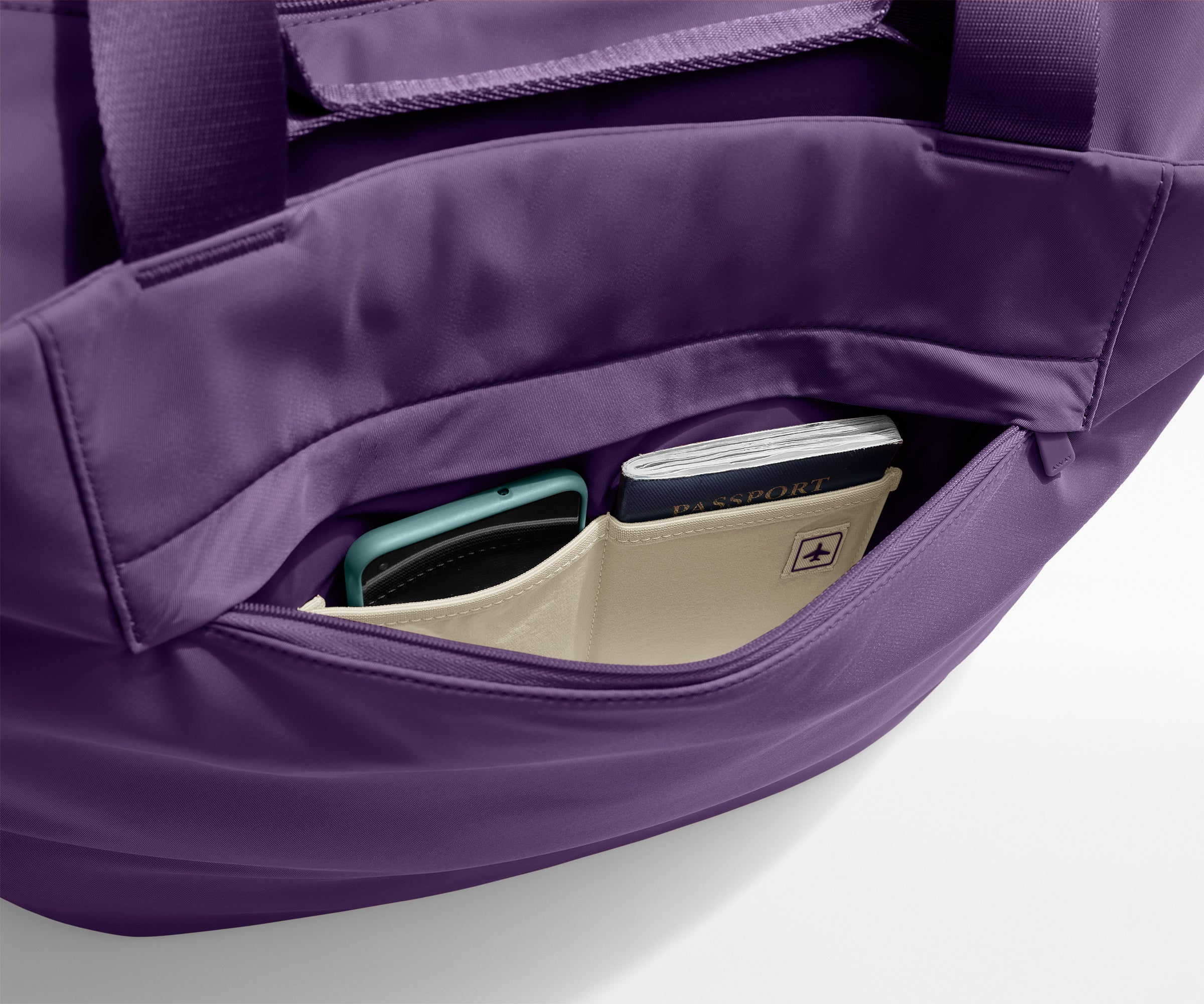 Phone and passport packed in an exterior zip pocket