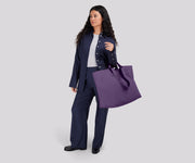 Person wearing the Large Featherlight Tote on their shoulder using the longer shoulder straps