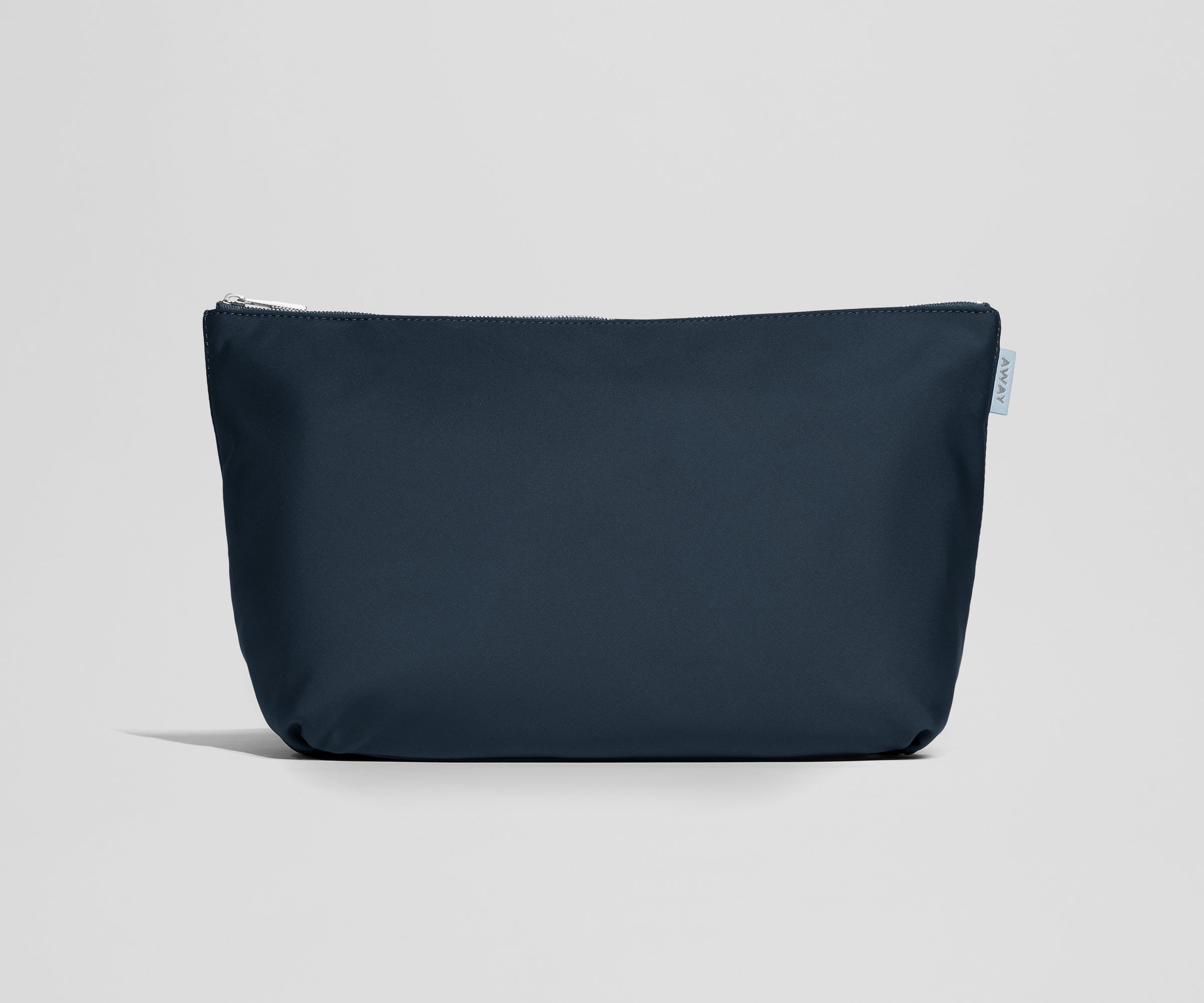 Navy blue pouch with a zipper on a light gray background