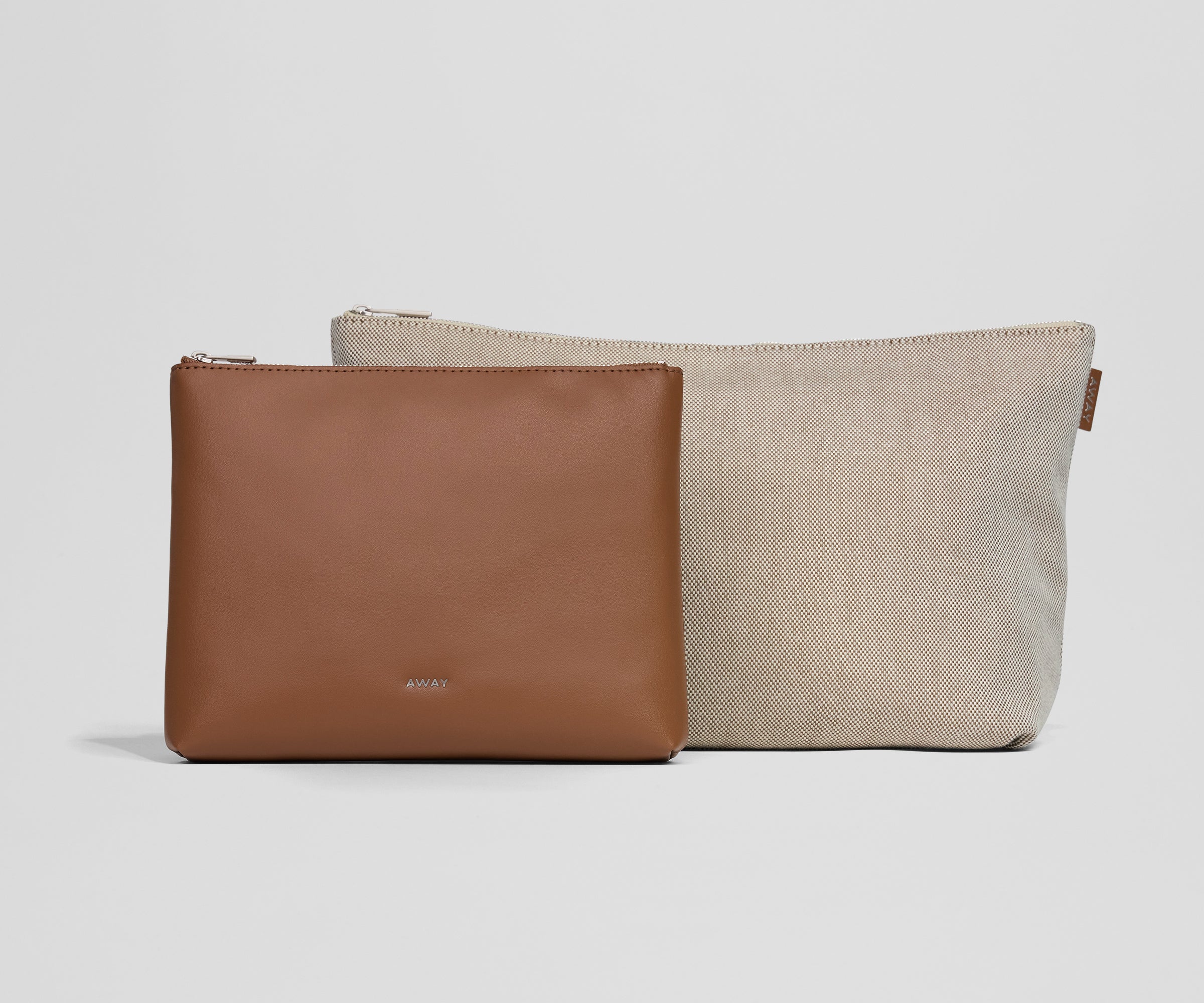 Two pouches, one brown and one beige, on a light gray background