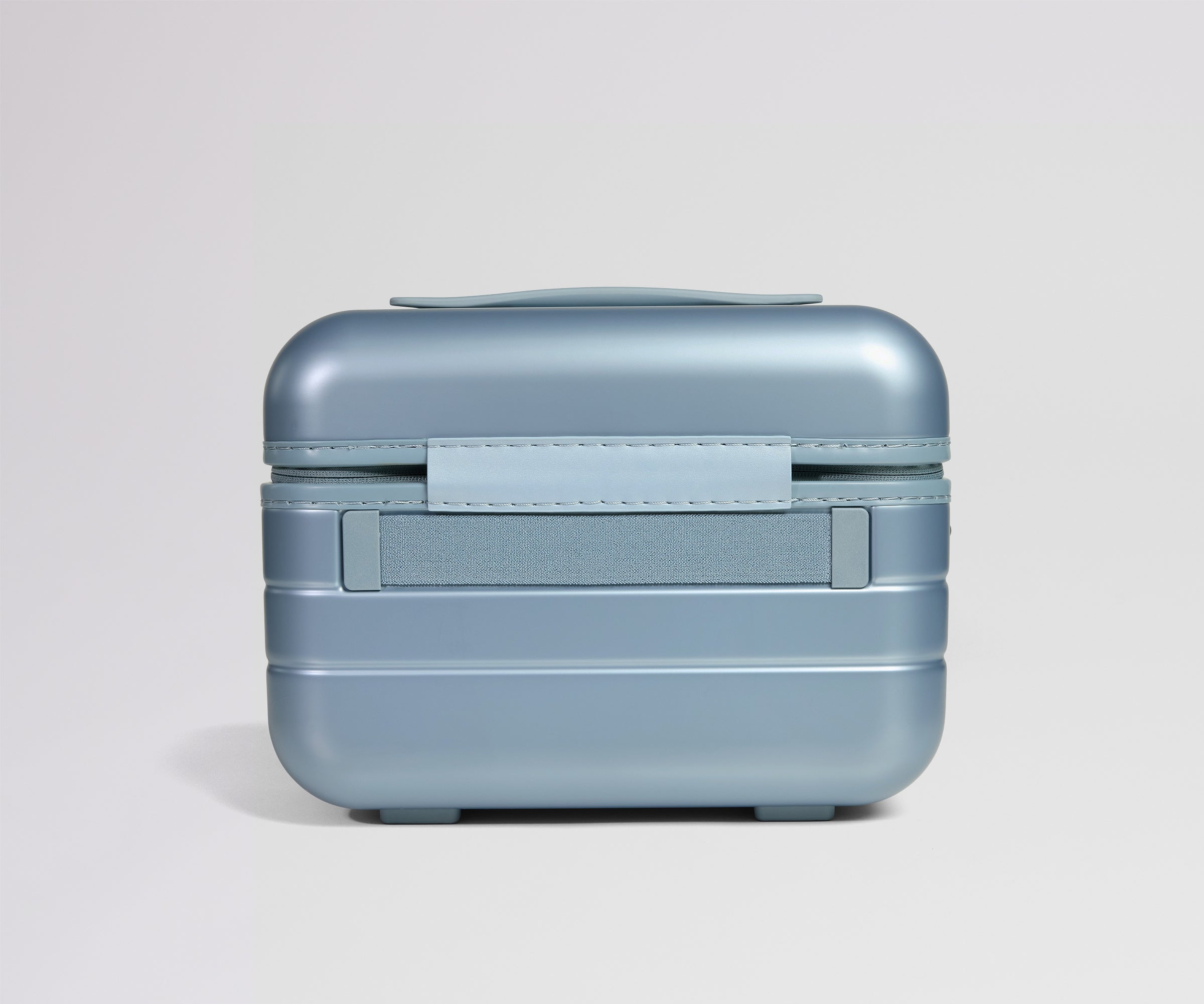 Blue travel case on a light gray background