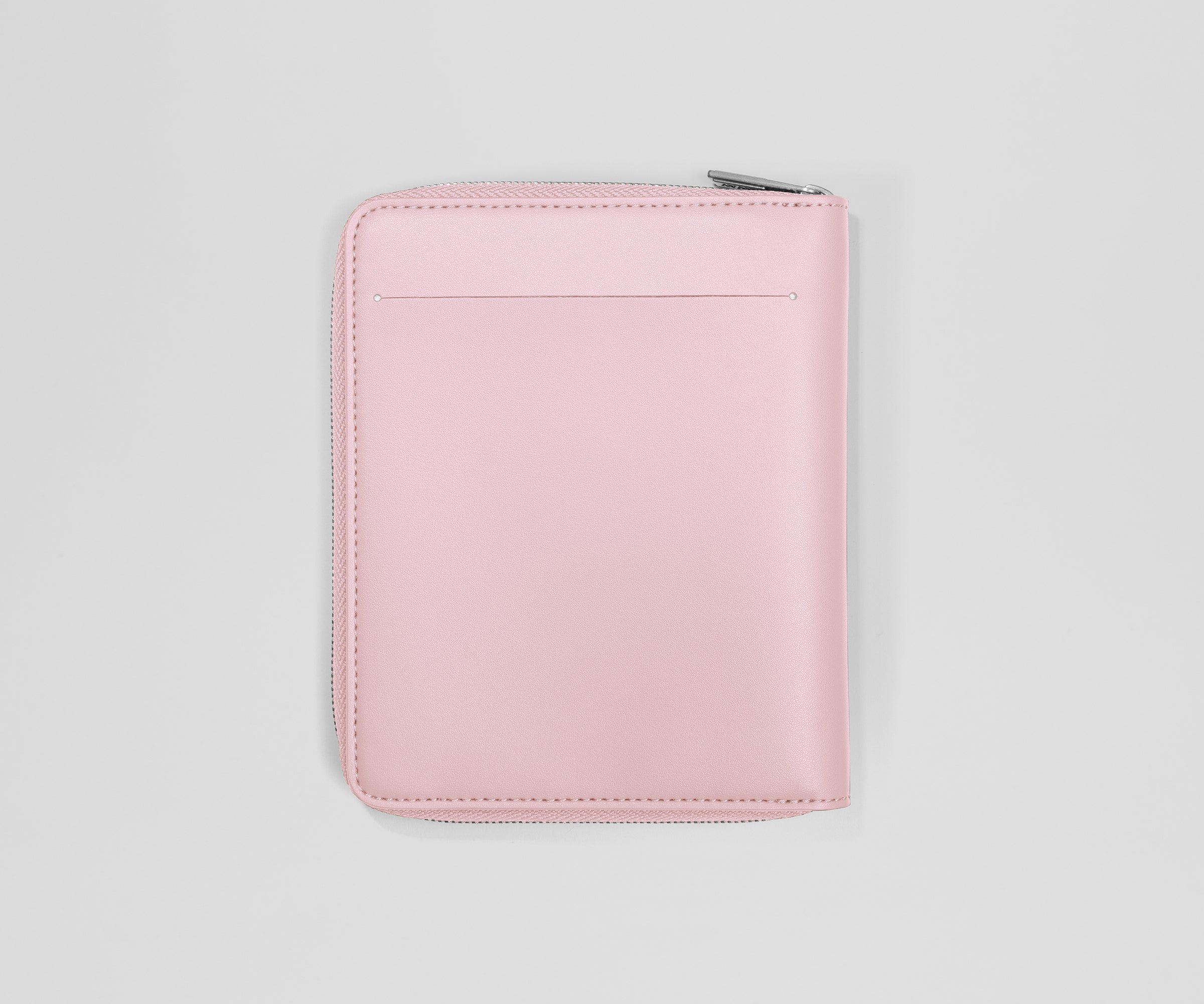 Pink travel wallet on a light gray background