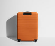 Back product view of The Large Flex suitcase in Sorbet Orange