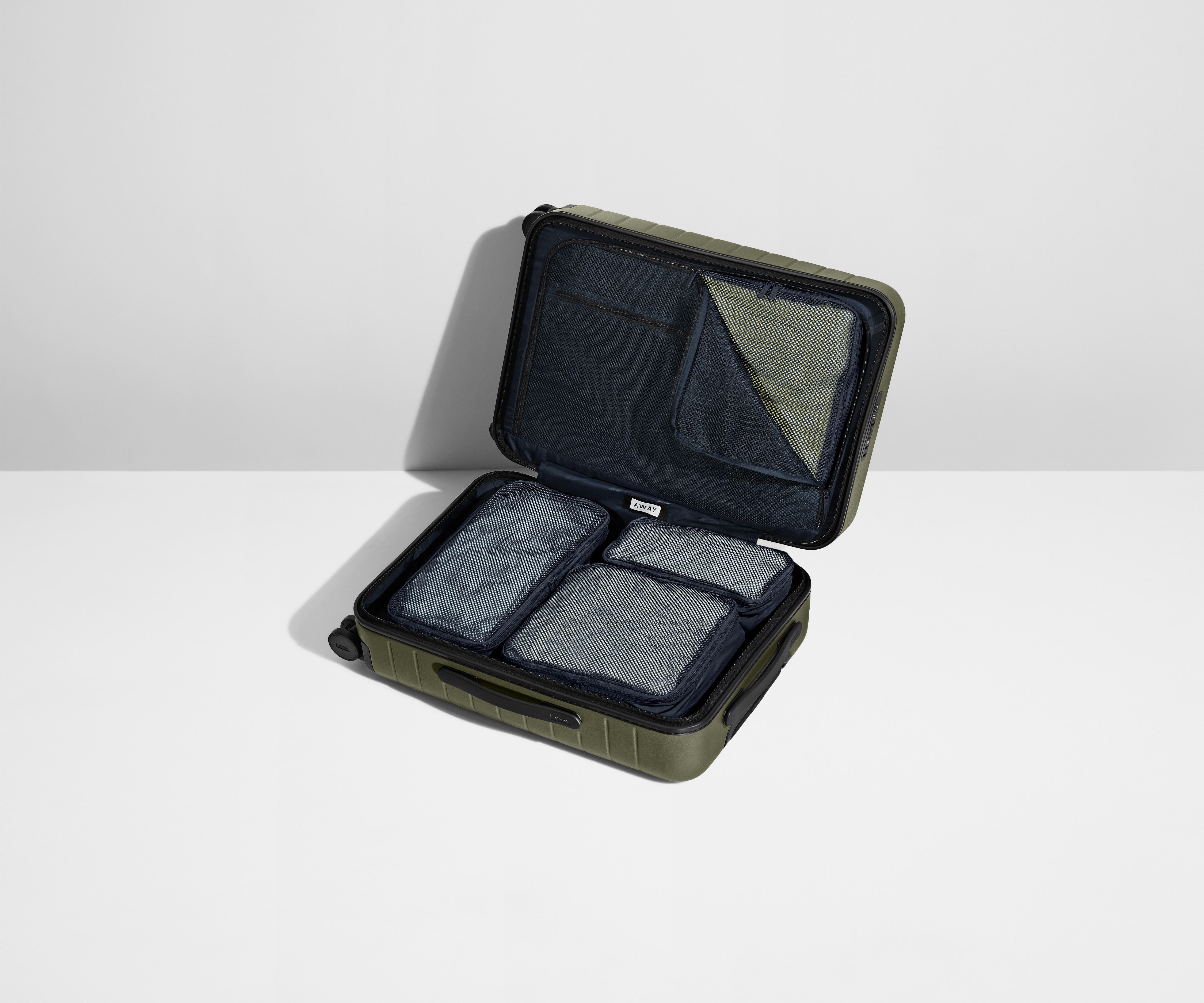 Four Insider Packing Cubes shown inside The Bigger Carry-On