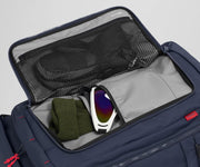 Gloves, beanie, and ski googles packed in the front flap pocket