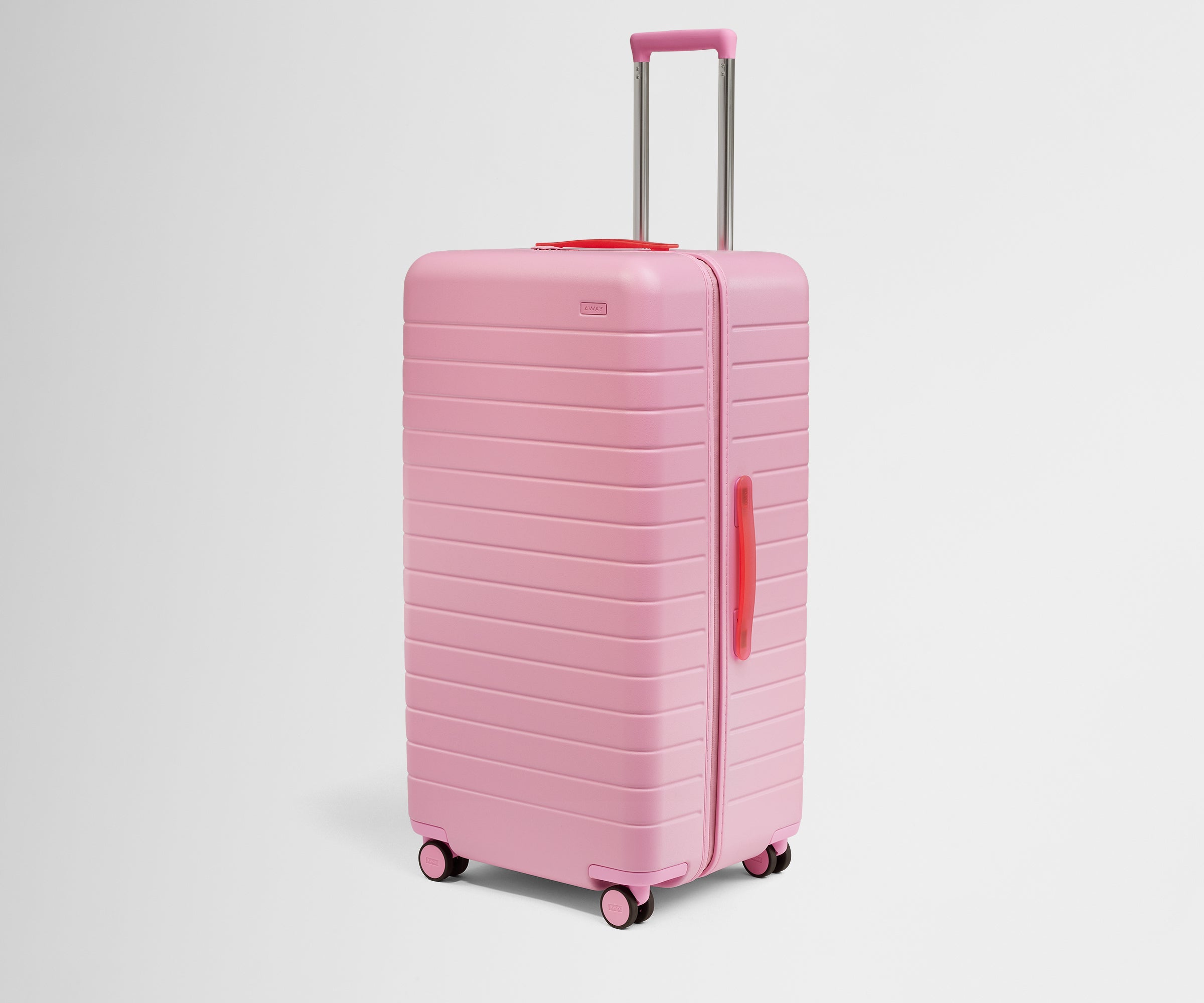 Angled product view of The Trunk suitcase in Hot Pink