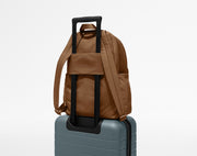 Large Featherlight Backpack on top of an Away suitcase