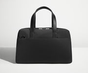 Front view of The Overnight Bag with leather straps up