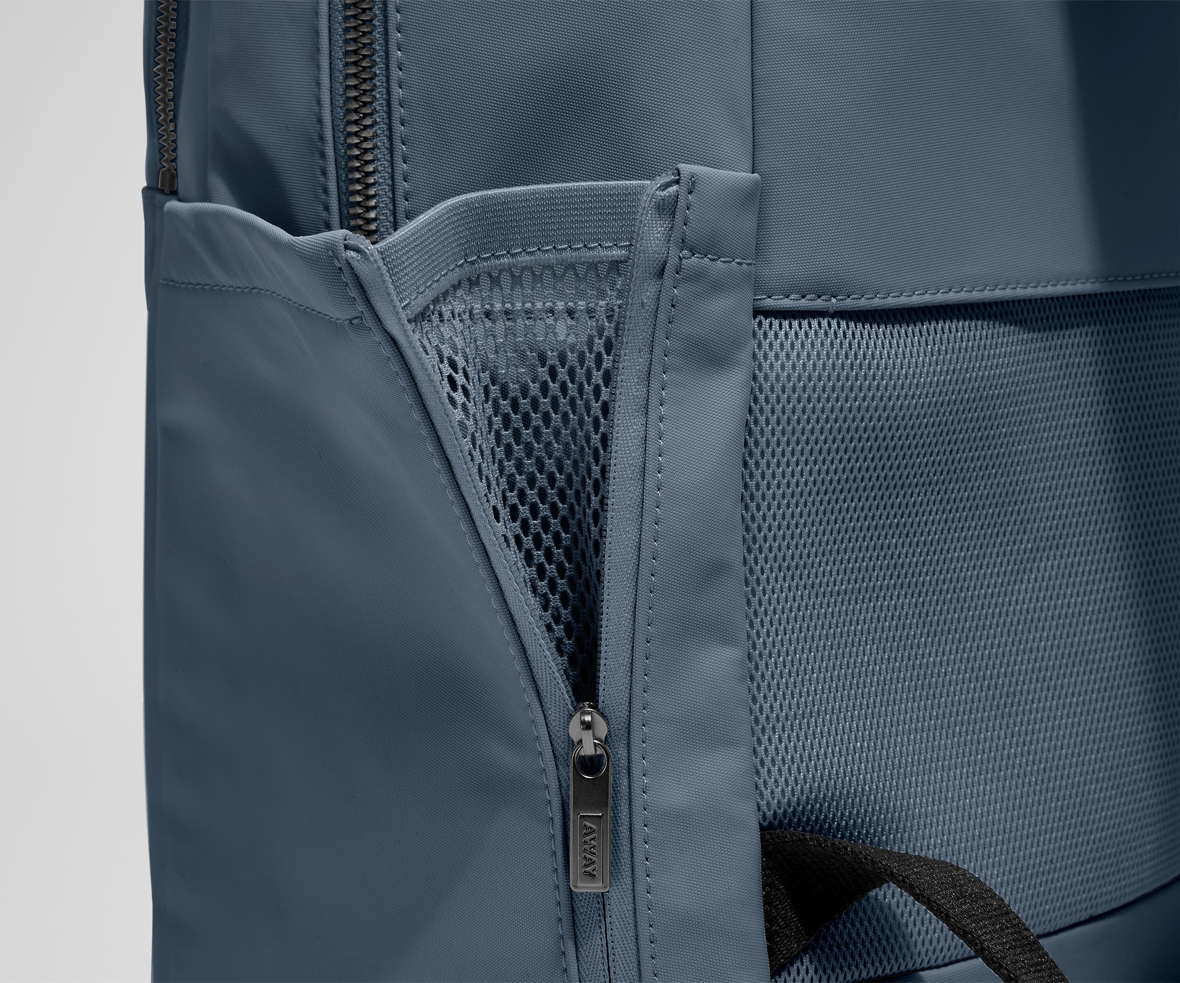 Close up view of the nylon material and exterior water bottle pocket