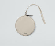 Front view of the Circle Zip Pouch with the leather strap