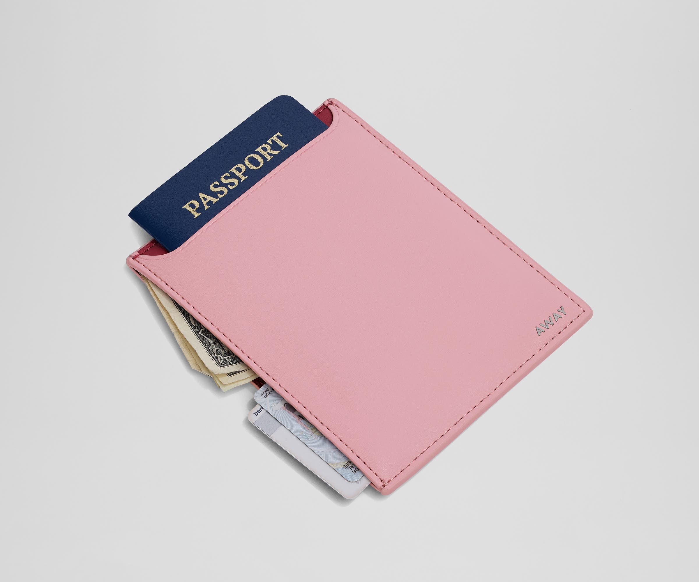 Passport wallet packed with a passport, money, and credit cards