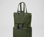 Double Diaper Tote on top of an Away suitcase by the trolley sleeve