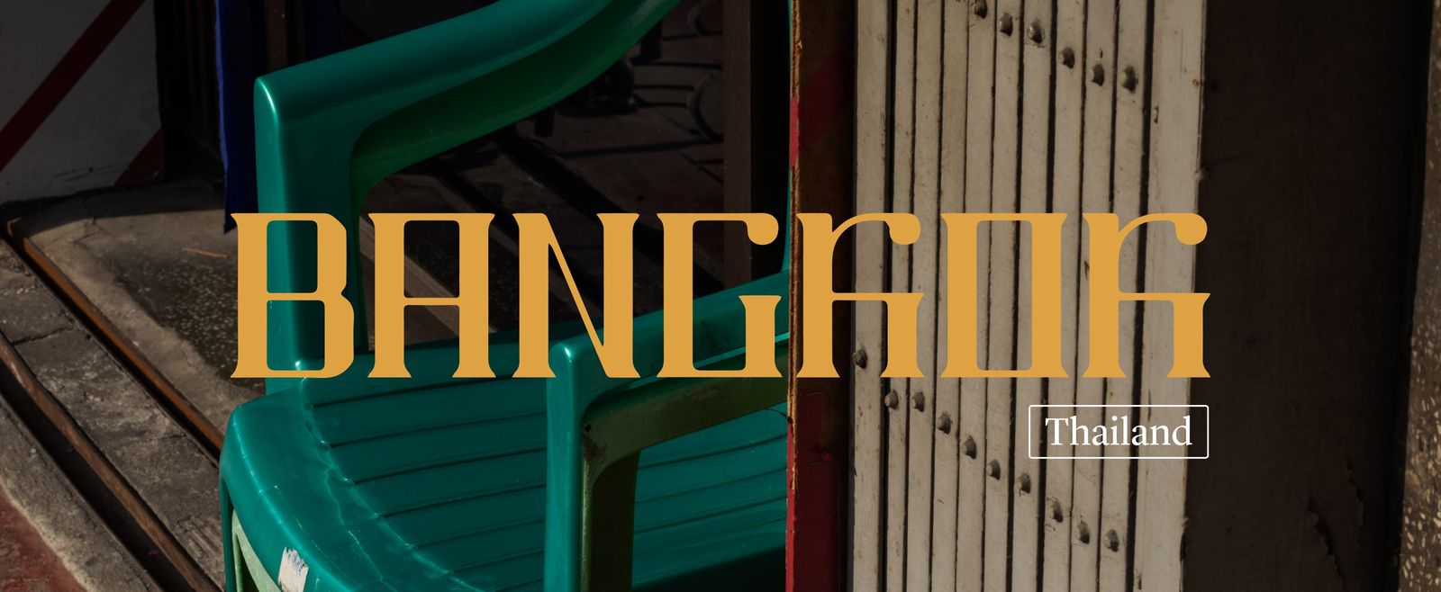 A close up shot of a green plastic chair at a storefront with the headline