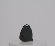 Video of a person packing the Featherlight Backpack with daily essentials