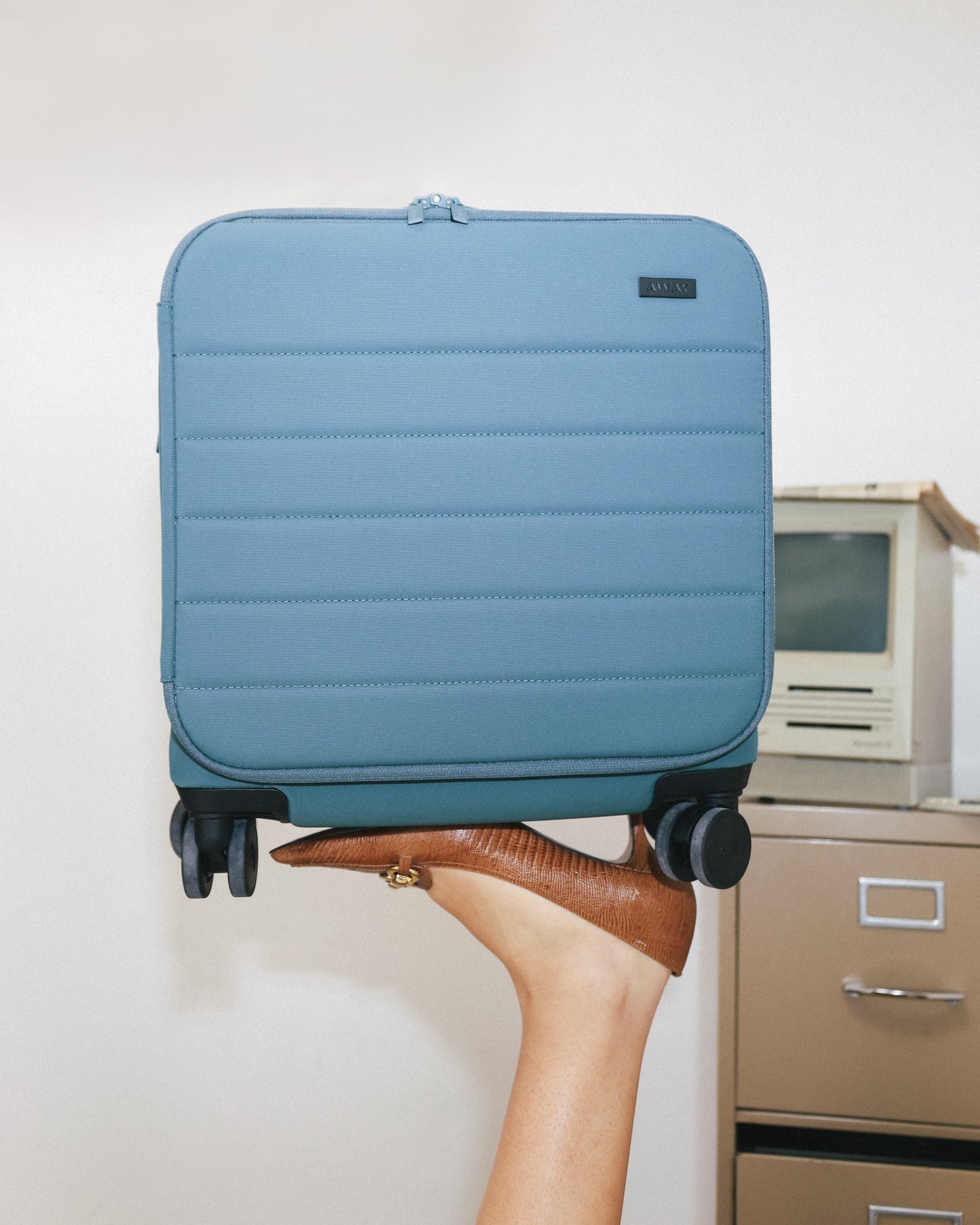 Shop Large & Checked Suitcases in Jet Black | Away
