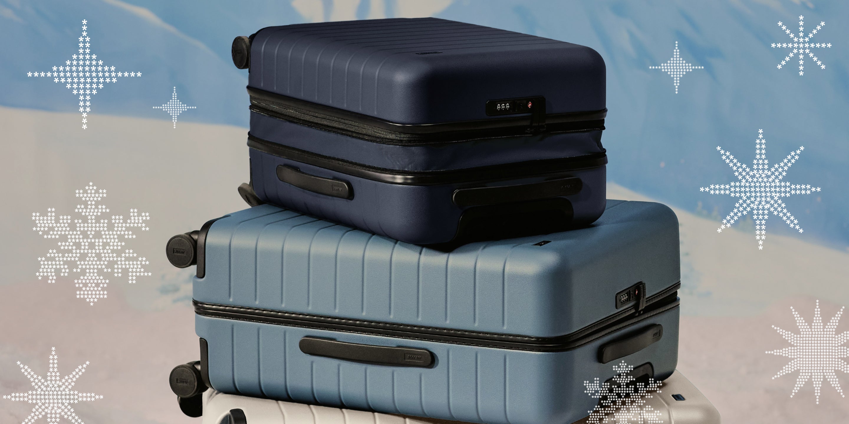 Three pieces of Away luggage, stacked vertically, set against a background of a snowy winter scene.