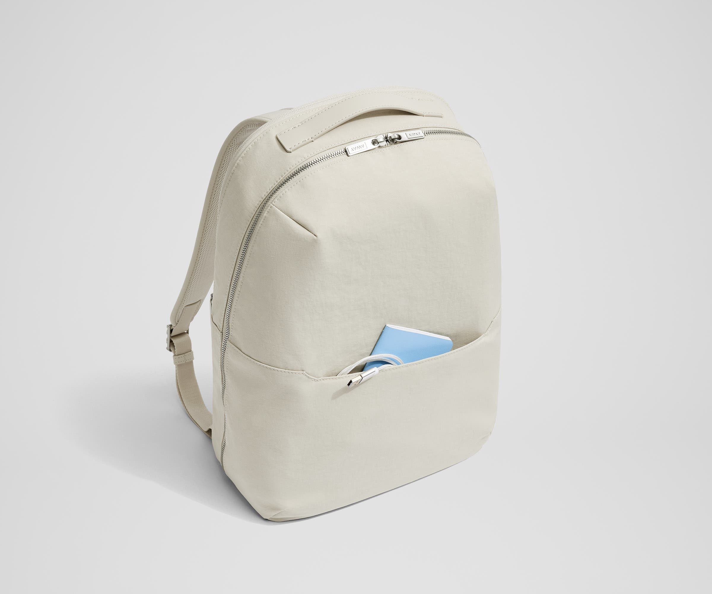 Small notebook and charging cord packed in the exterior front pocket