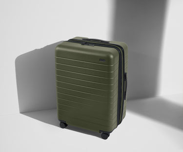 Angled product view of The Medium Flex suitcase in Sea Green