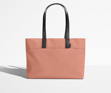 Front view of The Everywhere Tote with its leather handles up
