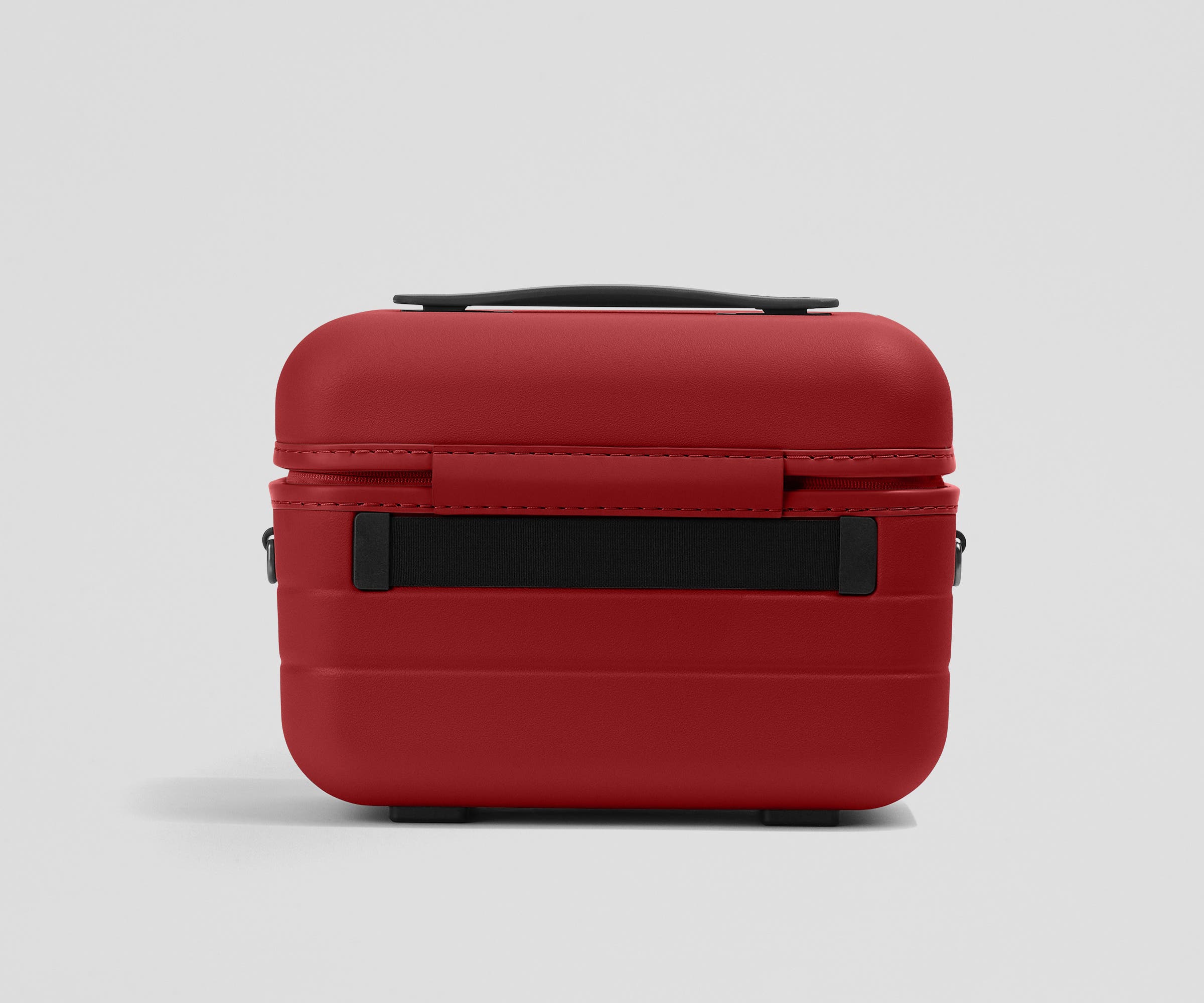 Elastic trolley strap on the back of the Train Case
