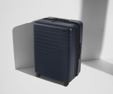 Angled product view of The Large Flex suitcase in Navy Blue