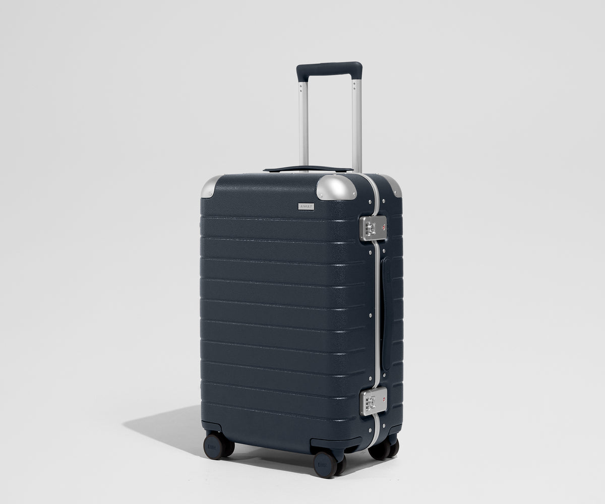 The Aluminum Edge Bigger Carry-On in Navy Blue