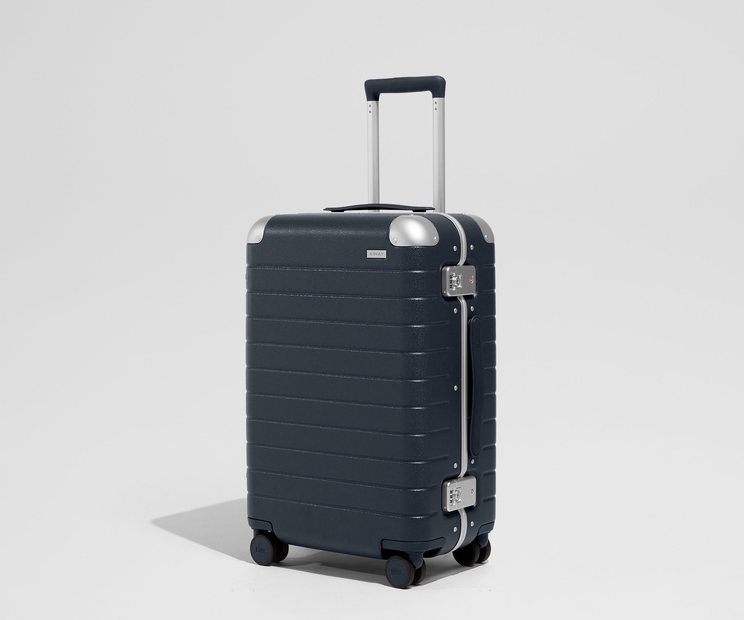 The Aluminum Edge Bigger Carry-On in Navy Blue