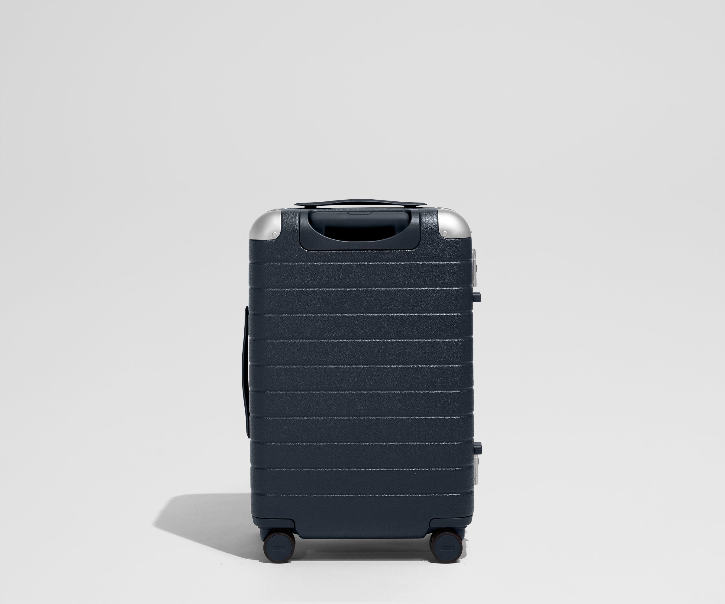 The Aluminum Edge Bigger Carry-On in Navy Blue