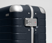 The Aluminum Edge Bigger Carry-On in Navy Blue