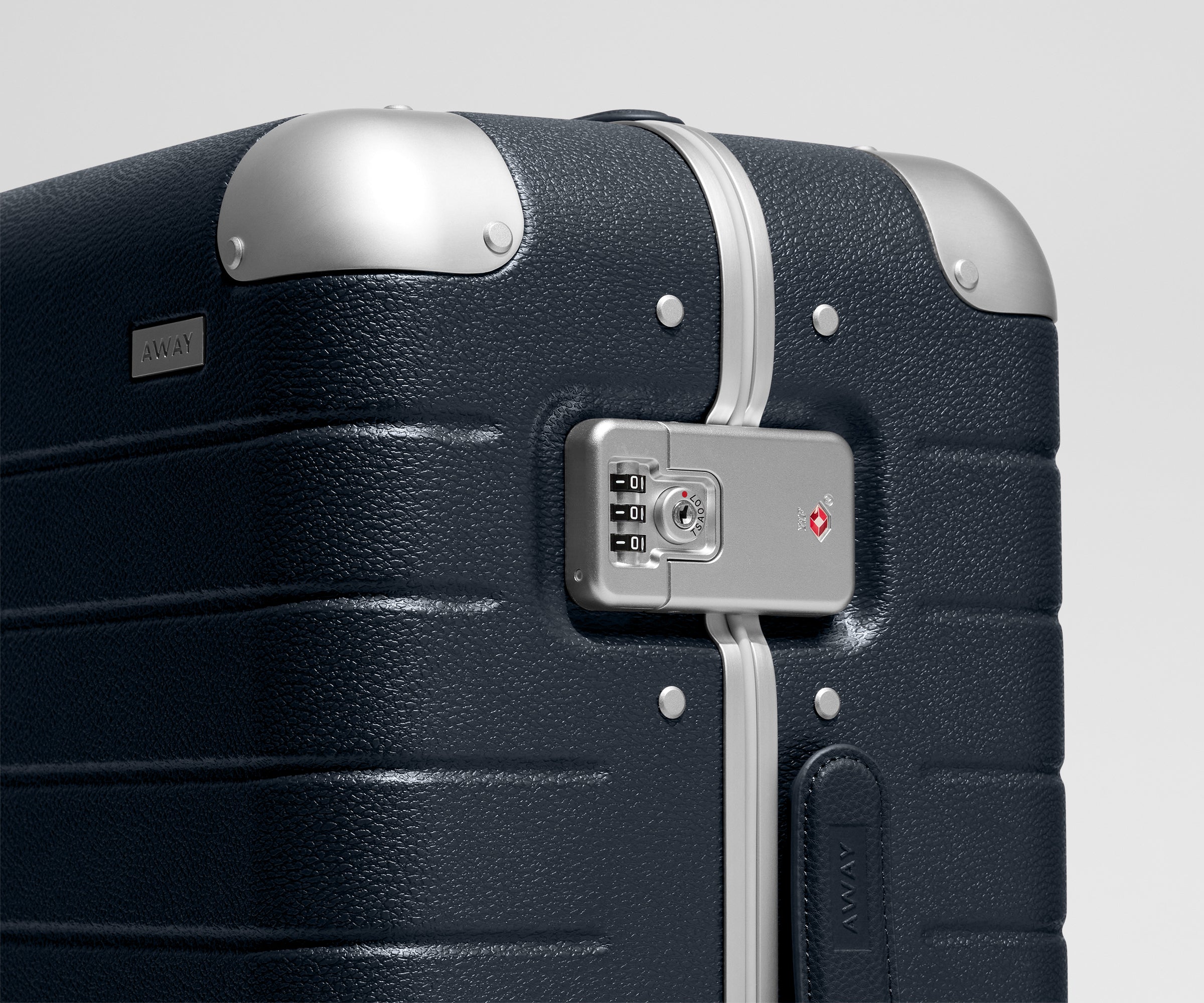 The Aluminum Edge Bigger Carry-On in Navy Blue