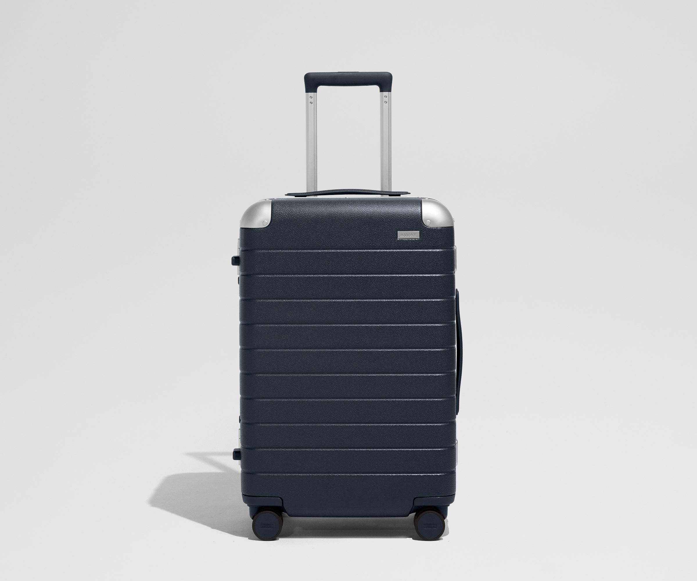 The Aluminum Edge Bigger Carry-On in Navy Blue